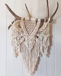 large macrame wall hanging with tree