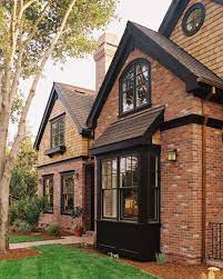 red brick houses with black trim