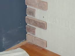 attach brick veneer to an inside wall