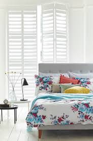 combining shutters with curtains the