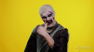 creepy man with scary halloween zombie