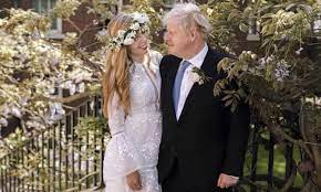 The prime minister boris johnson, 56, looked dapper as he tied the knot with carrie, 33, who was wearing a long white wedding dress, in front of a select group of guests at westminster cathedral D4jxmaf8vogetm