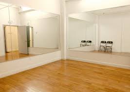 large mirrors and wooden floors