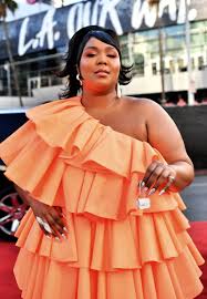 lizzo takes the tiny bag trend to the