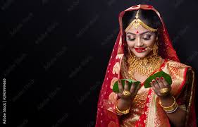 a beautiful happy indian bride holding