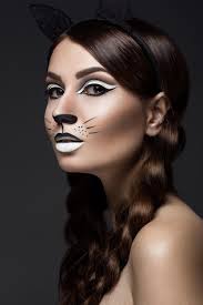 cat with art makeup and lace ears