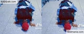nigerian lady rolls on the floor at