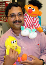Venkat Krovi with animated toys used to help high school students understand robotics. *. Download Hi-Res - elmo