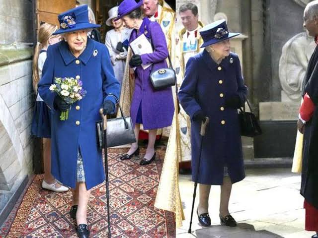 Queen Elizabeth II uses a cane to walk into Westminster Abbey