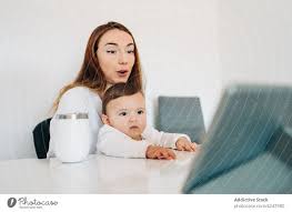 mother and baby watching video on