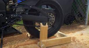 Powder coated stands and lifts are ideal for garage and workshop environments since they will withstand rust well. Wooden Motorcycle Lift Stand Woodworking Talk Woodworkers Forum Diy Motorcycle Homemade Motorcycle Motorcycle