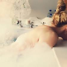 Madonna poses naked in bubble bath and says she's 