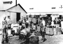 prohibition article s america khan academy photograph of men dumping barrels of alcohol outside of a warehouse