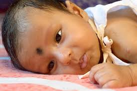 cute onemonthold indian baby boy lying