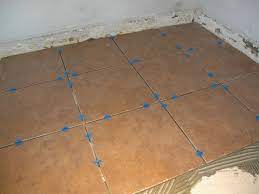 Can you tile a kitchen yourself. How To Install A Tile Floor In A Kitchen How Tos Diy