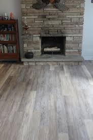 75 Vinyl Floor Living Room With A Stone