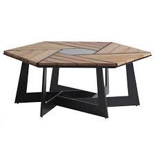 This high quality steel table base is entirely handmade out of steel and it's one the top is made of solid wood, the table frame is made of sturdy, matt crude steel. Tommy Bahama South Beach Teak Wood Top Metal Hexagonal Outdoor Coffee Table 41 W 50 W Kathy Kuo Home