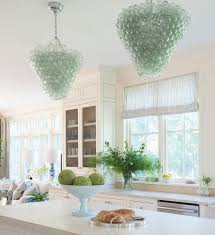 Green Glass Chandeliers Over Long
