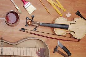 handmade violin guitar and hand tools
