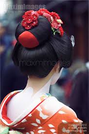 maiko geisha in bright red kimono