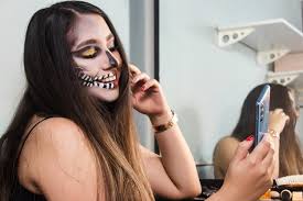 halloween skull makeup taking selfies