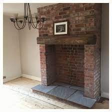 exposed brick fireplace with indian