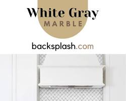 Mosaic tile backsplash in white kitchen