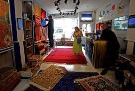 afghan rug weavers owing to western links