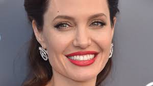 For the wedding, angelina wore black rubber pants and a white shirt on which she wrote her groom's name in blood. This Is Why Angelina Jolie Brought Her Kids To Meet Ex Husband Jonny Lee Miller
