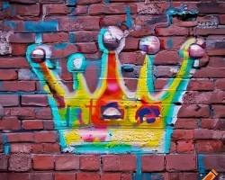 Image of colorful graffiti mural on a brick wall
