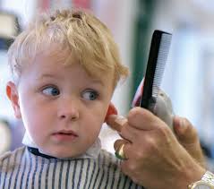 child s getting their hair cut
