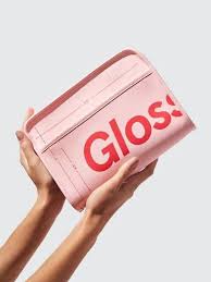 glossier makeup bag on designer wardrobe