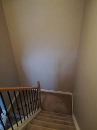 how do i decorate this tall stair wall
