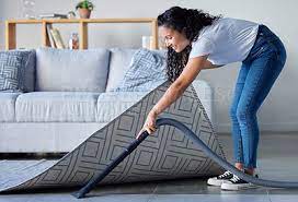 woman vacuum and cleaning carpet floor