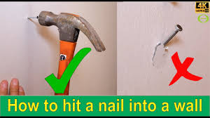 how to hammer a nail into a wall
