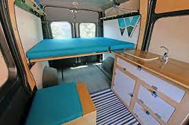 The bed can be propped up. Diy Camper Van 5 Affordable Conversion Kits For Sale