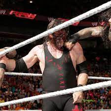GIF: Roman Reigns superman punch hits Kane so hard Randy Orton feels it -  Cageside Seats