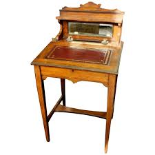 Round top contains three small drawers and one larger drawer, all lined. Antique English Inlaid Rosewood Child S Or Ladies Diminutive Writing Desk For Sale At 1stdibs