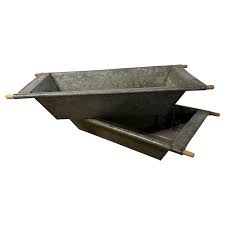 large galvanized iron troughs with wood