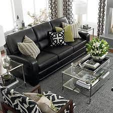 living room with a black leather sofa
