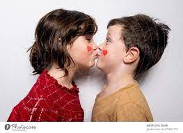 cute kids kissing each other a