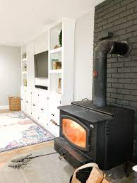 painted brick wood stove fireplace