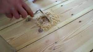sanding floorboards hammering in nails