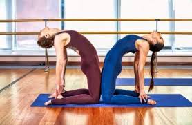 The presence of someone around motivates you to do better. 12 Easy Yoga Poses For Two People Friends Partner Or Couples Yoga Shape Mi Now Health Fitness Clothing Shapewear Store