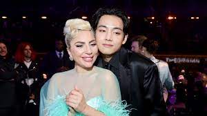 Lady Gaga and BTS' V stand cheek to cheek at the 2022 Grammys | Mashable