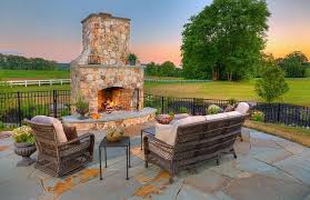 This wood burning fire pit conveniently features an opening that provides easy access to the fire to keep it going during outdoor gatherings. The Burning Question An Outdoor Fireplace Vs A Fire Pit