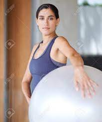 Balling Her Way To Fitness. A Beautiful Young Woman Holding A Fitness Ball.  Stock Photo, Picture and Royalty Free Image. Image 191706730.