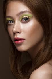 red hair with creative green makeup