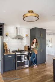 Kitchen cabinets will keep bottles of soap, fabric softener, household cleaners and other supplies out of sight. Kitchen Renovation With Dark Cabinets And Open Shelving Bigger Than The Three Of Us