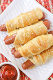 What is the best way to reheat pigs in a blanket?
